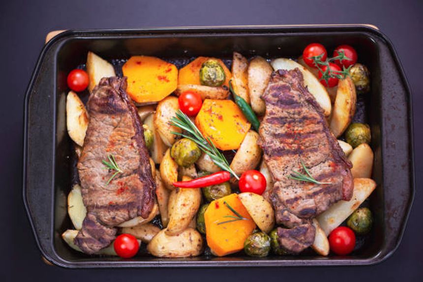 grilled steak with potatoes and vegetables