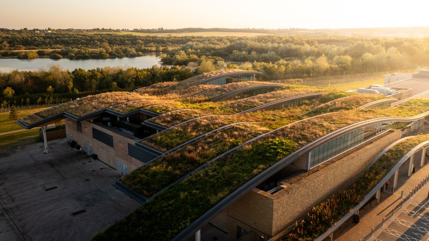Aerial view of a mature and extensive living roof on the building of a responsible building providing biodiversity and insulation whilst reducing the carbon footprint