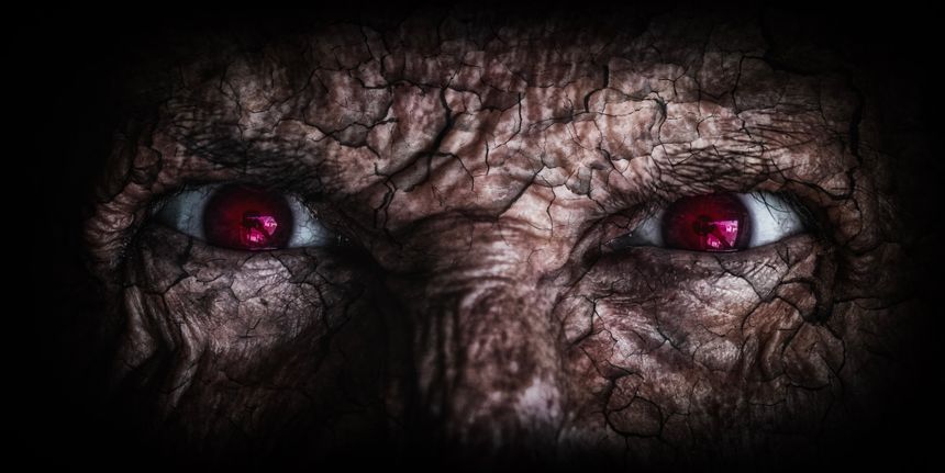 The Haunting Gaze of an Ancient Demon with Glowing Red Eyes